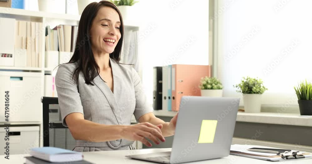 Business woman typing on laptop keyboard and rejoicing 4k movie slow motion Business woman typing on laptop keyboard and rejoicing 4k movie slow motion