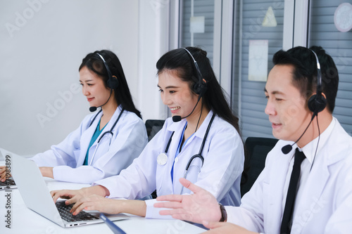 team doctor and nurse working call center operator with headset in hospital or workplace