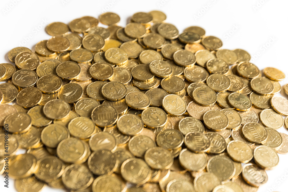 Heap of coins spilled on white background Heap of coins spilled on white background