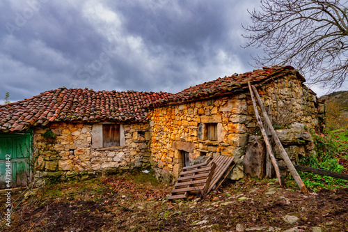 Rural village of Bustariega - Street with abandoned houses photo