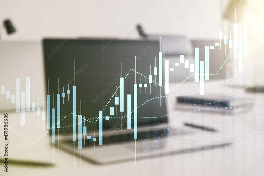 Multi exposure of abstract financial graph on laptop background, financial and trading concept Multi exposure of abstract financial graph on laptop background, financial and trading concept