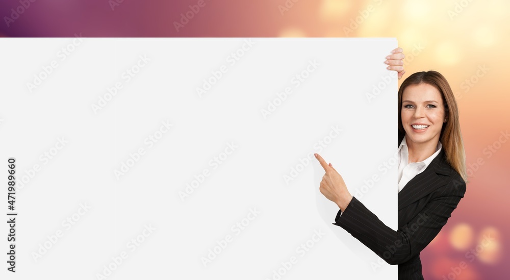 Intresting Offer. Happy Casual Woman Peeping Out The Side Of White Advertisement Board Intresting Offer. Happy Casual Woman Peeping Out The Side Of White Advertisement Board