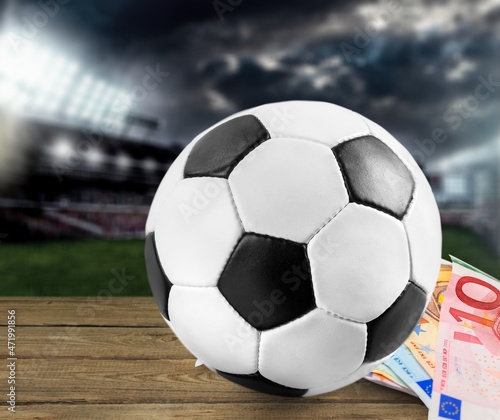Dollars and the soccer ball. Sports betting, soccer betting, gambling, bookmaker, big win