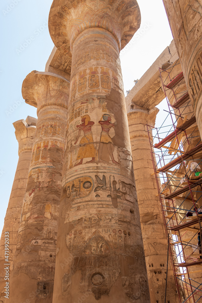 Luxor, Egypt - September 21, 2021: Cleaning of the 134 columns in the Great Hypostyle Hall at the Karnak Temple Complex.