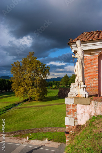 The Walls of Lucca. View of San Donato (St Donatus) Gate with cloudy sky photo