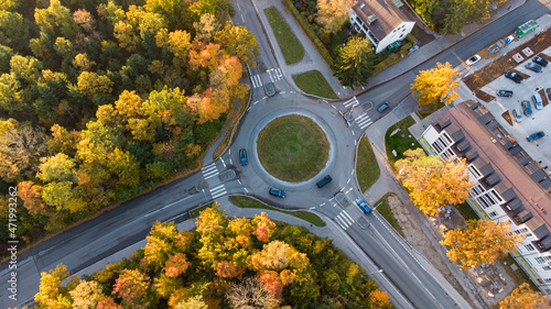 Aerial view of traffic in a roundabout next to a city in Germany