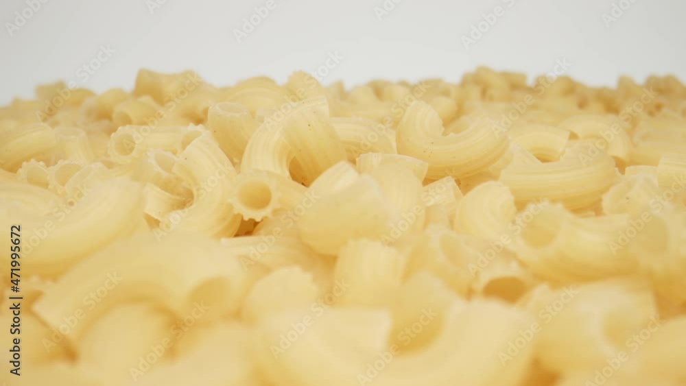 MACRO: Many pasta on a white background, Dolly shot MACRO: Many pasta on a white background, Dolly shot