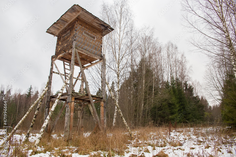 Hunting tower in the forest. Observation tower for hunting in the forest.