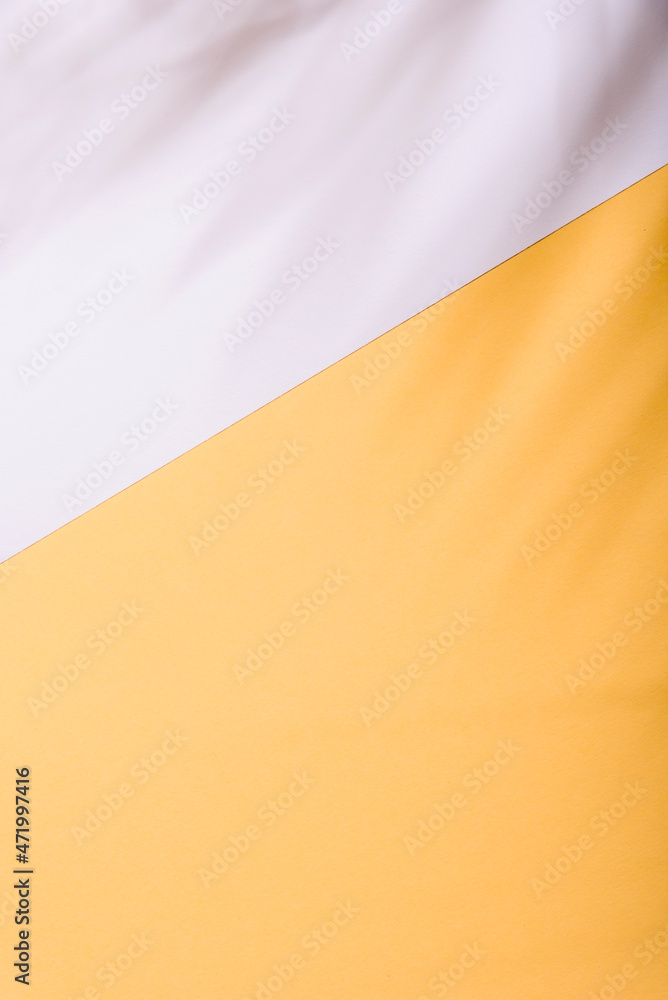 Warm yellow and white summer color background with tropical palm shadow ...