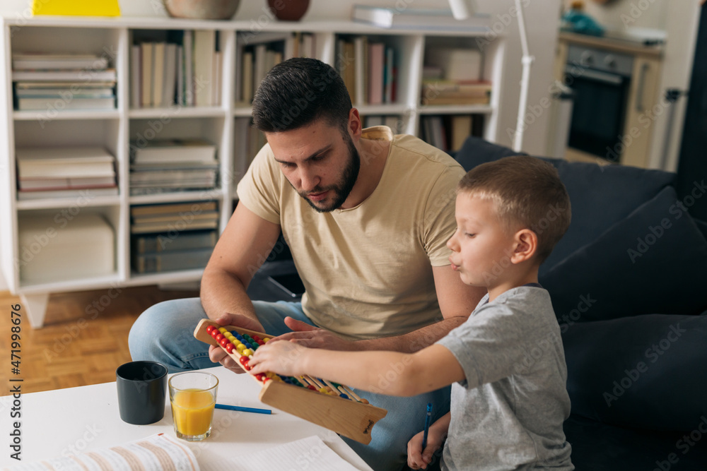 father and son enjoying time together at home father and son enjoying time together at home
