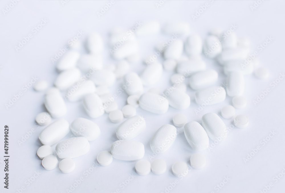 Pills on white background. Medical care and treatment