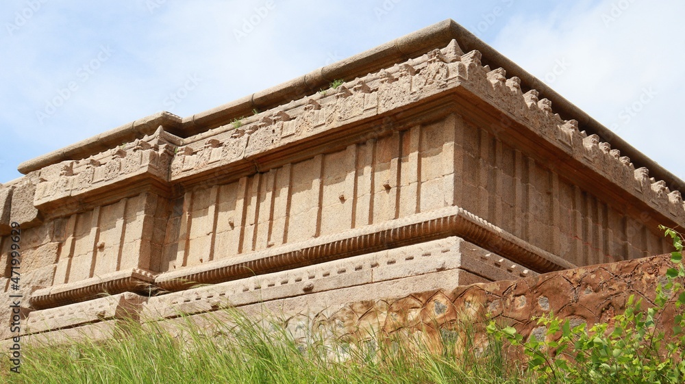 It is considered to belong to the Vijayanagara period. Its a posterior outer side wall. Carved stone sculpture. This is an unfinished temple. It is considered to belong to the Vijayanagara period. Its a posterior outer side wall. Carved stone sculpture. This is an unfinished temple.