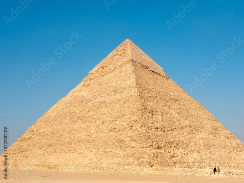 Giza  Cairo  Egypt - September 30  2021  Egyptian pyramid against the blue sky. Close-up.