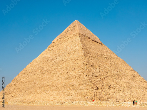 Giza  Cairo  Egypt - September 30  2021  Great Egyptian pyramid against the blue sky. Close-up.