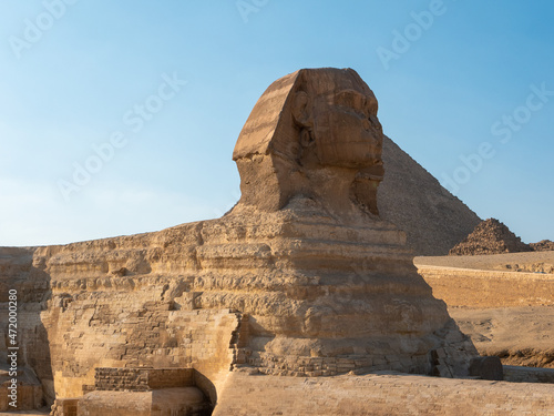 Statue of the Great Sphinx on the Giza plateau against the blue sky.