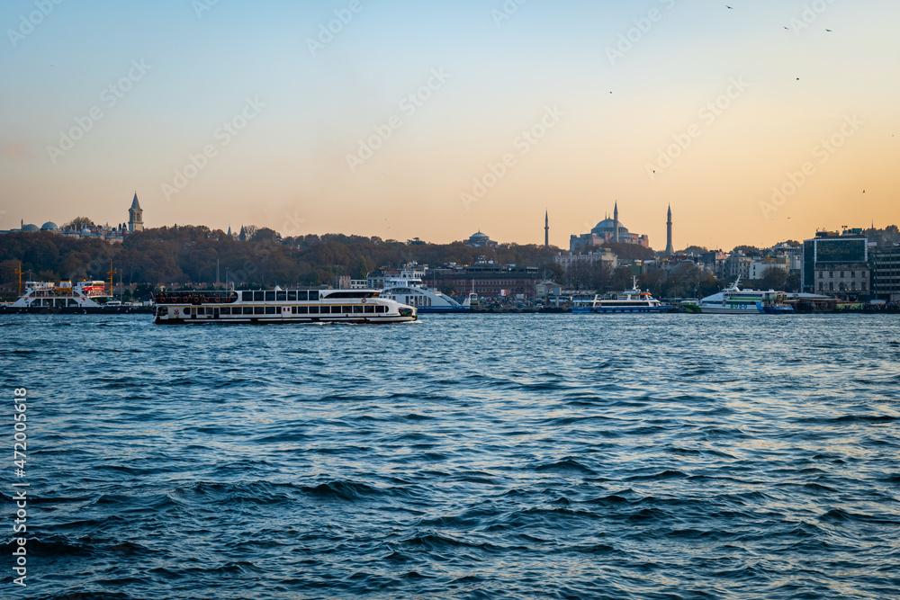 Bosphorus, the Strait of Istanbul, cruise and ferry view at sunset. Istanbul cityscape with the famous landmarks seen from Bosphorus.	
