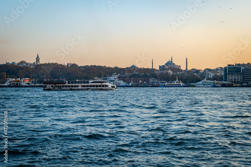 Bosphorus, the Strait of Istanbul, cruise and ferry view at sunset. Istanbul cityscape with the famous landmarks seen from Bosphorus.   © uskarp2