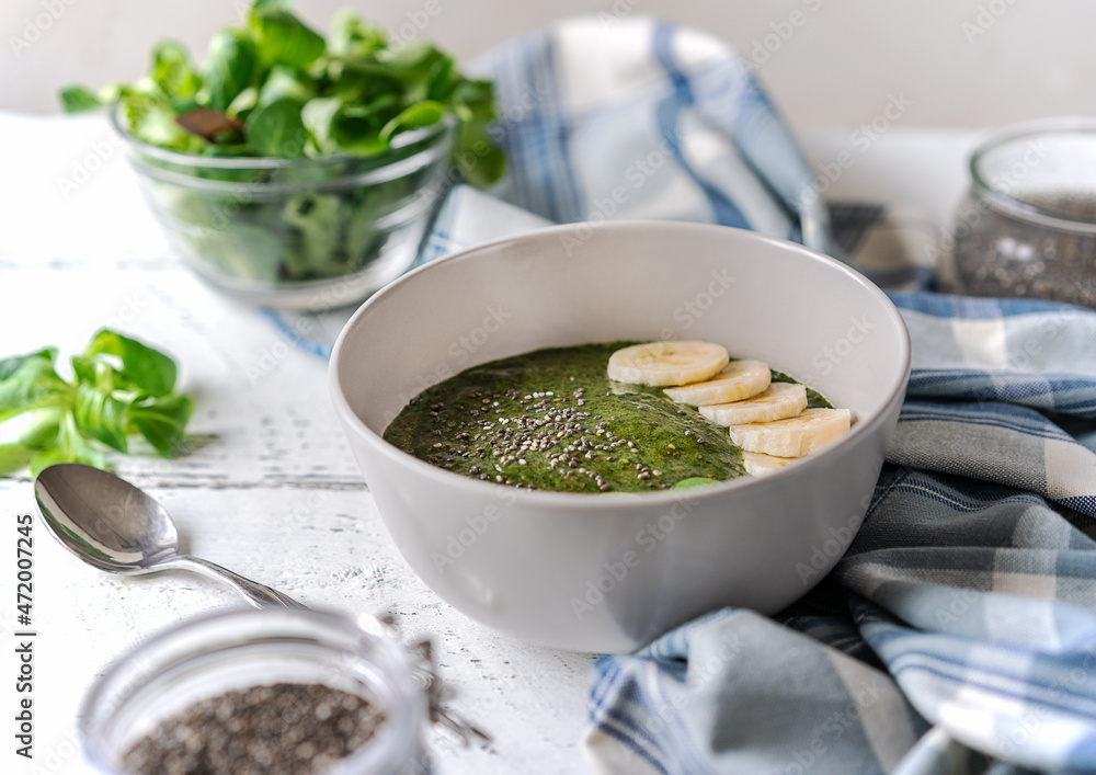 Green porridge in bawl with main ingredients: chia seeds, greens Green porridge in bawl with main ingredients: chia seeds, greens
