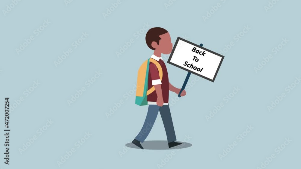 African schoolboy holding a back to school text African schoolboy holding a back to school text