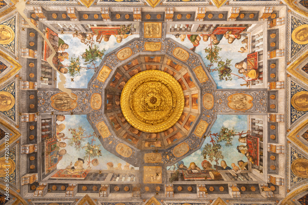 FERRARA, ITALY - NOVEMBER 9, 2021: The renaissance ceiling frescoes in the   palace Palazzo Costabili by Benvenuto Tisi (Garofalo 1481 – 1559)