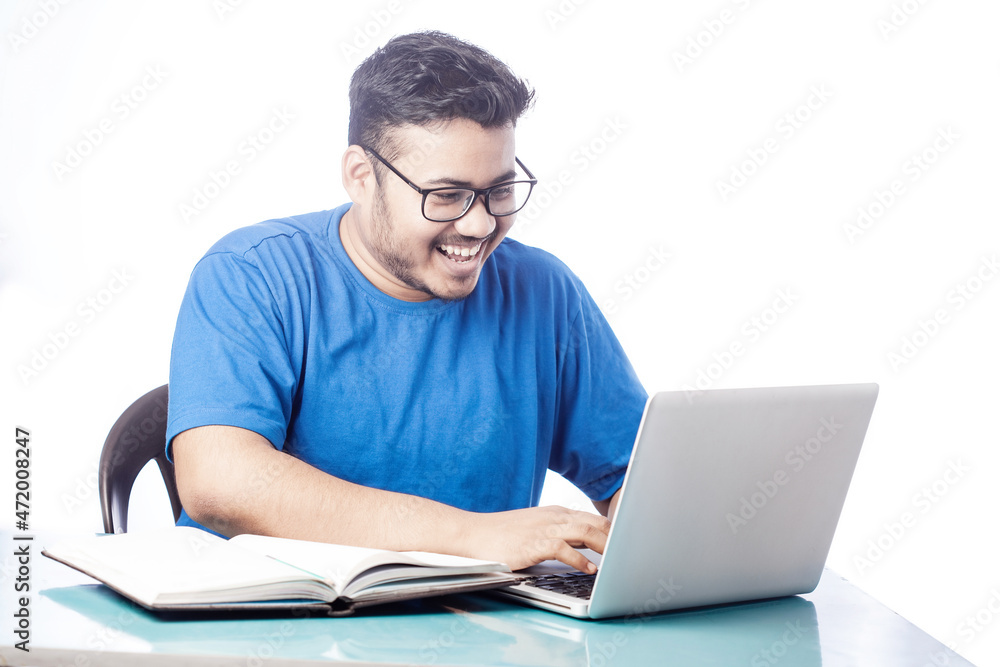 cheerful student studying online course on laptop
