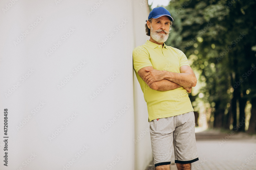 Middle aged man jogging in park Middle aged man jogging in park