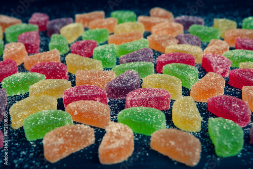 Dessert marmalade in the form of lemon and orange slices. The sweetness of jelly candy. photo