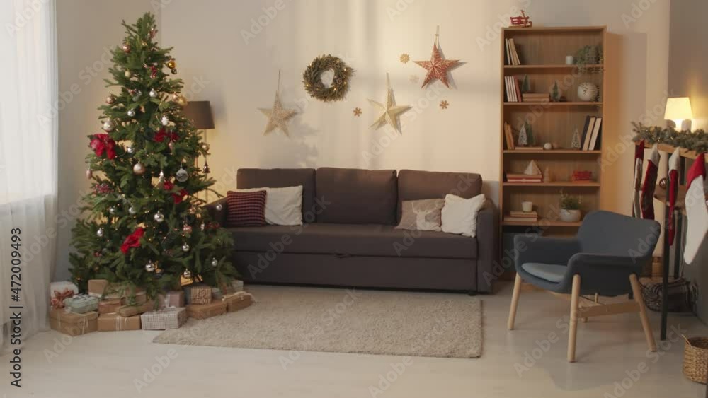 Handheld shot of festive living room decorated for Christmas Handheld shot of festive living room decorated for Christmas