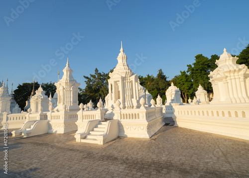 White pagoda or stupa of Wat Suan Dok buddhist Temple, Chiang Mai City, Thailand. Thai architecture. Tourist attraction landmark.