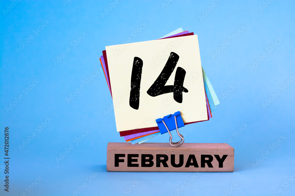 Fototapeta premium February 14th. Day 14 of February month, calendar on blue workplace background. Winter time
