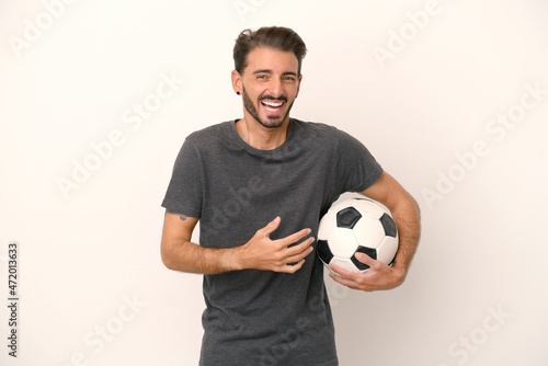 Young football player woman isolated on white background smiling a lot