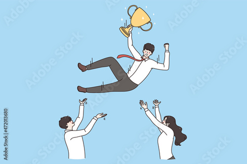 Leadership and celebrating success concept. Business team colleagues holding and pulling their leader man on hands with golden trophy for first prize vector illustration 