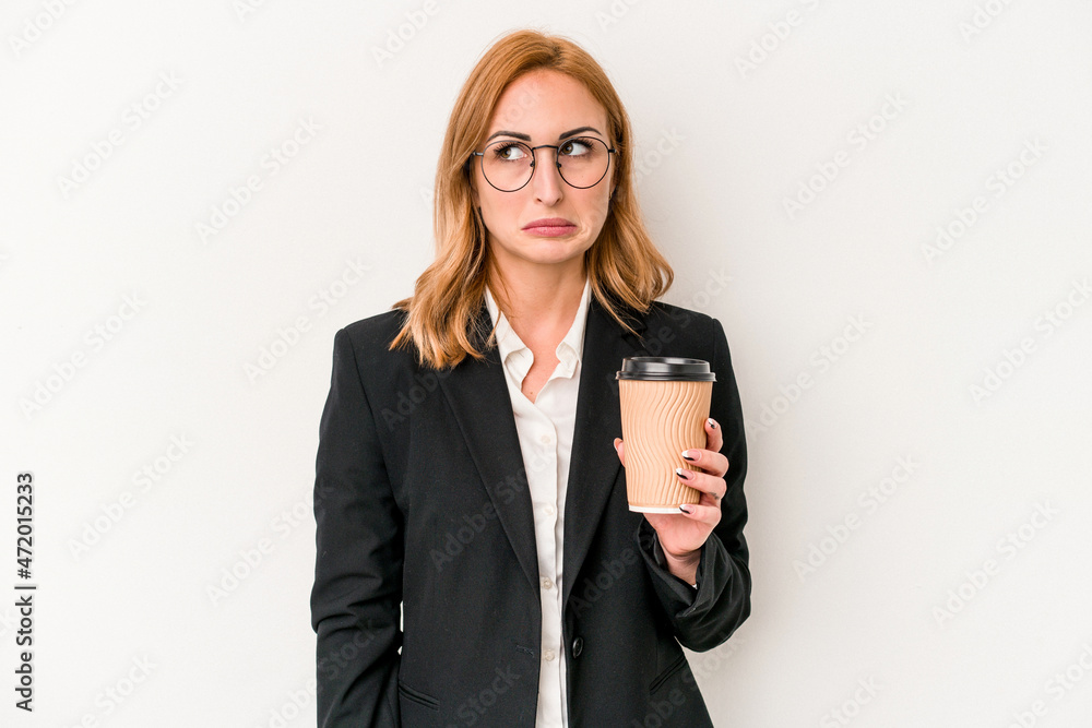 Young business caucasian woman holding take away coffee isolated on white background confused, feels doubtful and unsure. Young business caucasian woman holding take away coffee isolated on white background confused, feels doubtful and unsure.