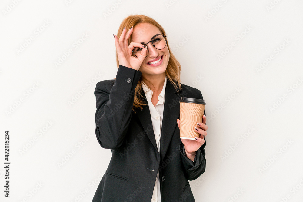 Young business caucasian woman holding take away coffee isolated on white background excited keeping ok gesture on eye. Young business caucasian woman holding take away coffee isolated on white background excited keeping ok gesture on eye.
