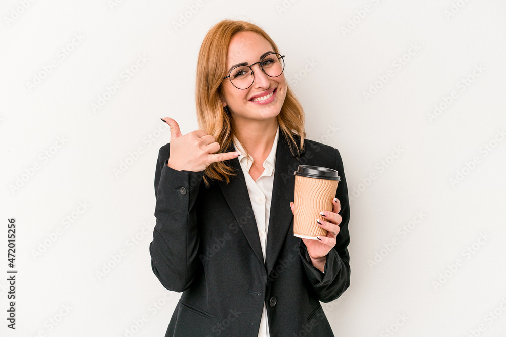 Young business caucasian woman holding take away coffee isolated on white background showing a mobile phone call gesture with fingers. Young business caucasian woman holding take away coffee isolated on white background showing a mobile phone call gesture with fingers.