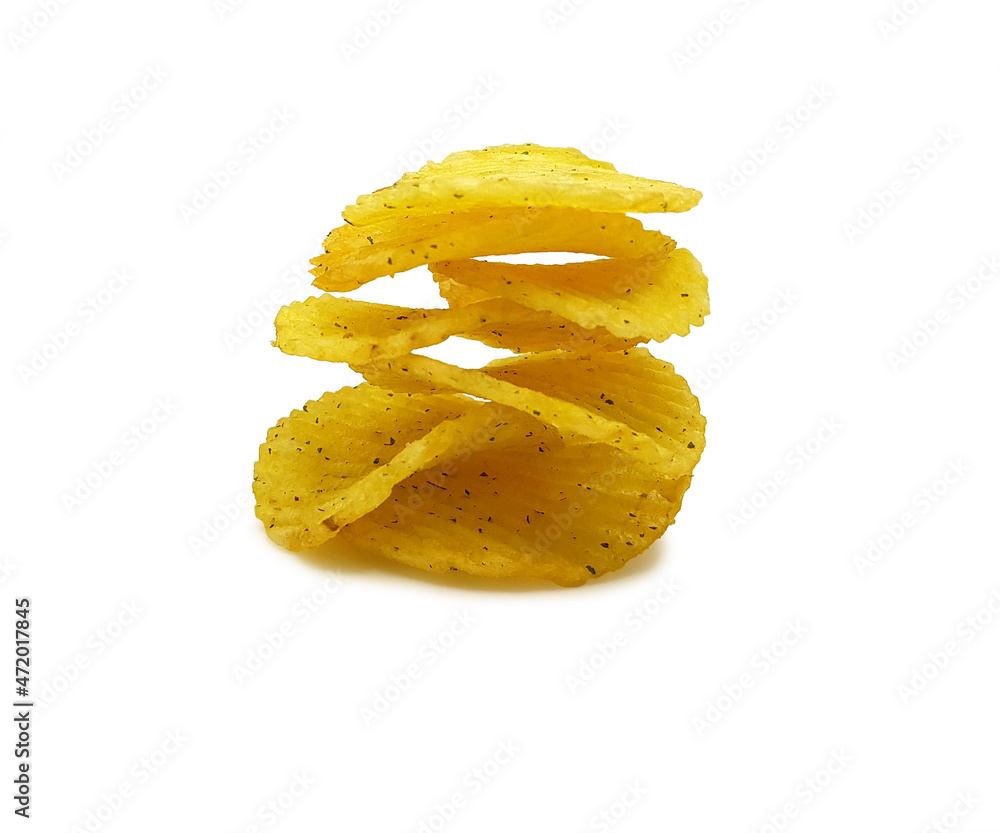 Rippled potato chips with spice isolated on white background Rippled potato chips with spice isolated on white background