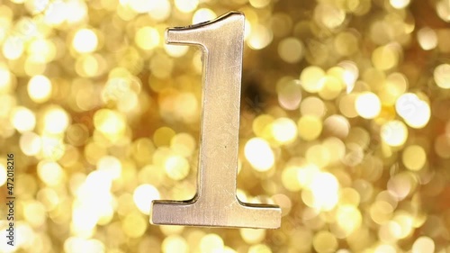 Golden number one and golden screen background.