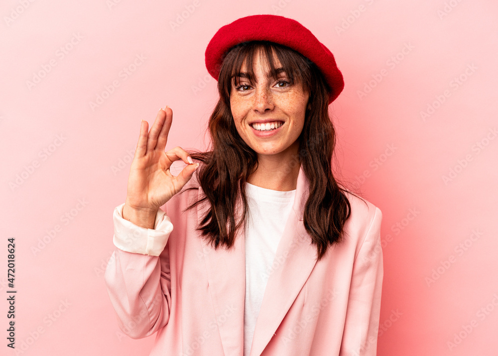 Young Argentinian woman isolated on pink background cheerful and confident showing ok gesture. Young Argentinian woman isolated on pink background cheerful and confident showing ok gesture.