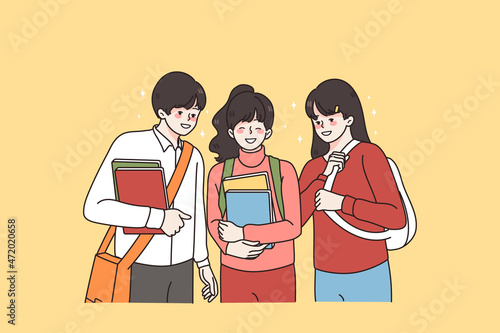 Learning friendship and school times concept. Group of smiling positive school kids boy and girls standing with books and backpacks feeling excited vector illustration 