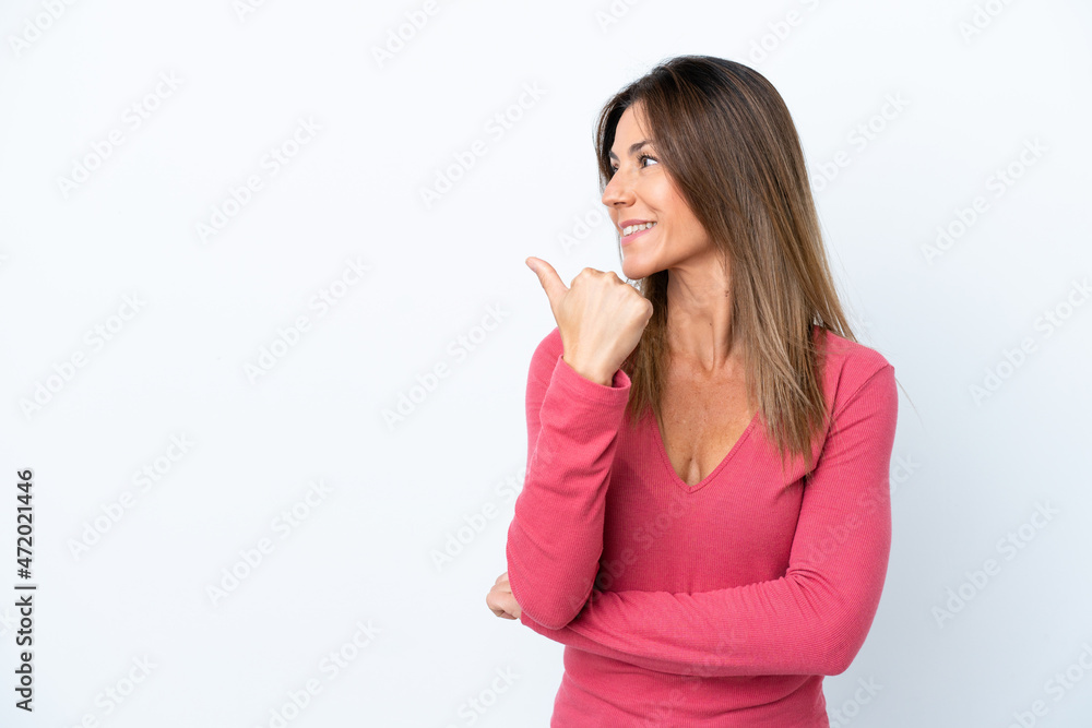 Middle age caucasian woman isolated on white background pointing to the side to present a product Middle age caucasian woman isolated on white background pointing to the side to present a product