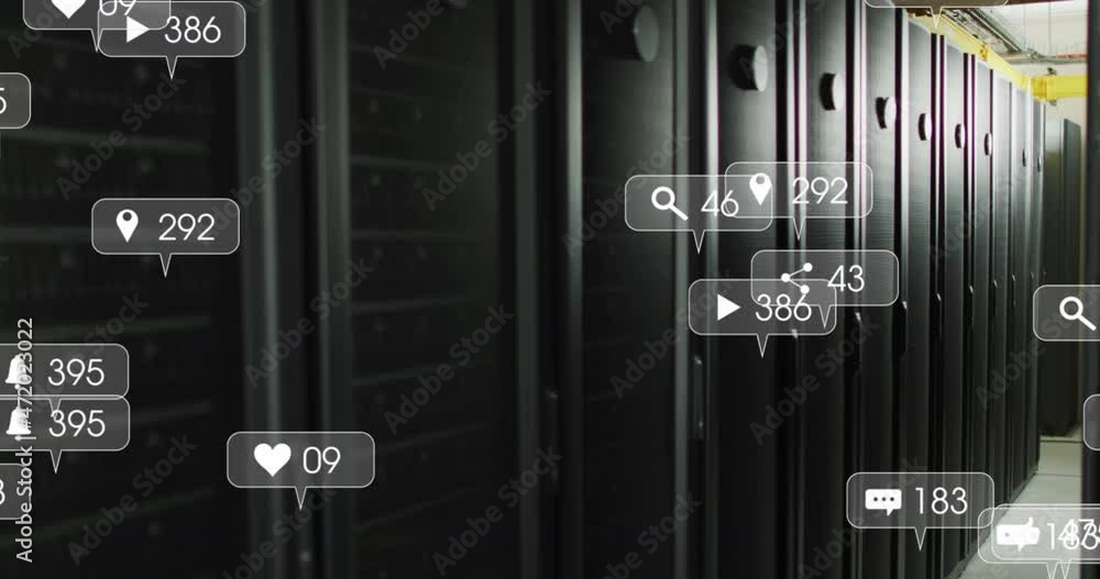 Animation of social media text and icons over tech room with computer servers Animation of social media text and icons over tech room with computer servers
