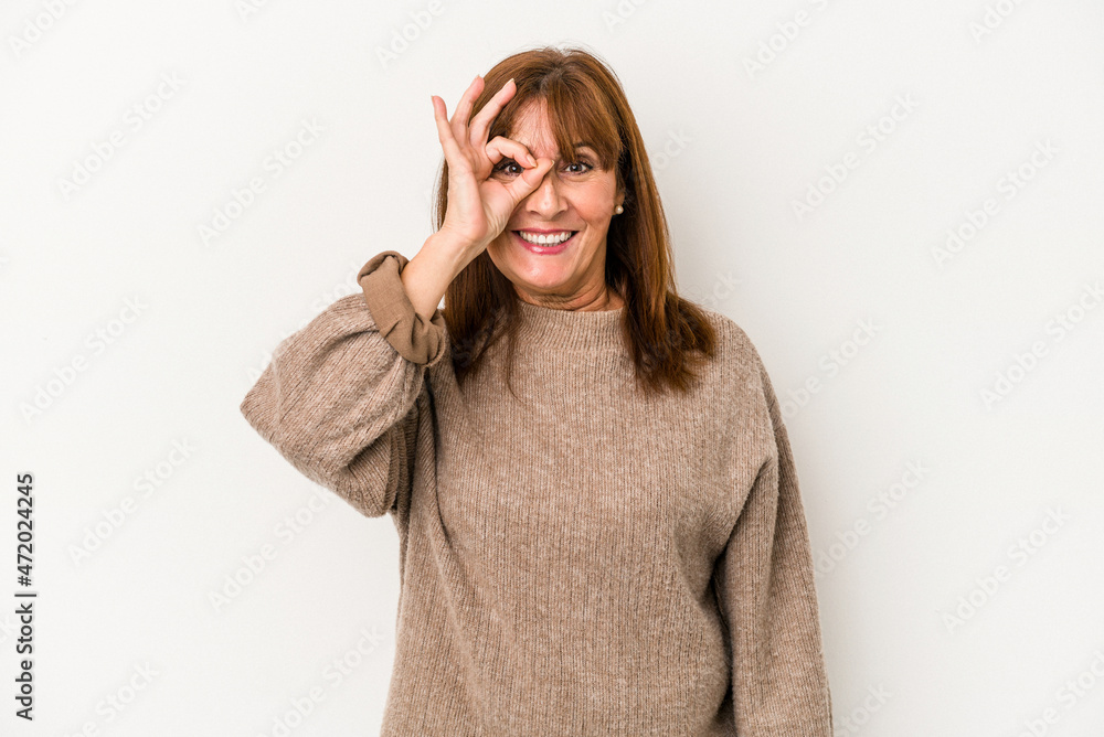 Middle age caucasian woman isolated on white background excited keeping ok gesture on eye. Middle age caucasian woman isolated on white background excited keeping ok gesture on eye.