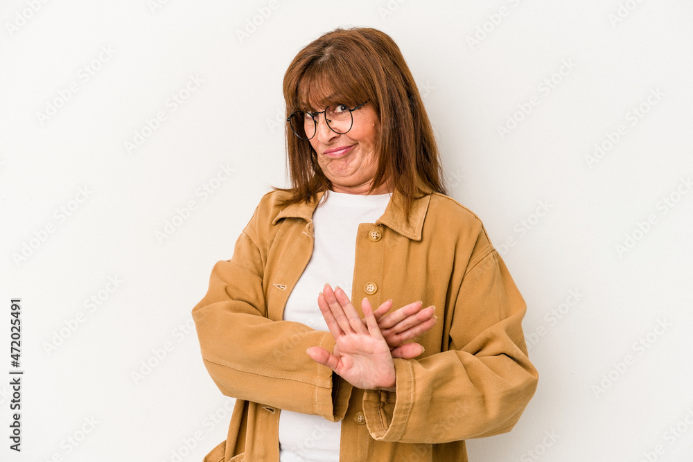 Middle age caucasian woman isolated on white background doing a denial gesture Middle age caucasian woman isolated on white background doing a denial gesture