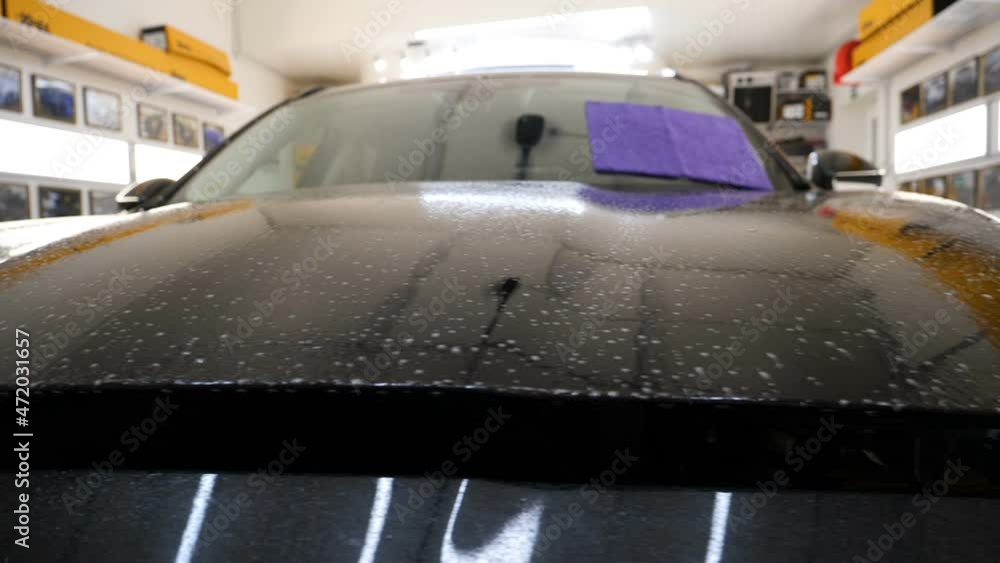 Close up to PPF installation process on a front headlight and hood. PPF is a Paint Protection Film which protect paint from scratches and stone chips. Concept of: Guard, Protect, Car, New, Work.
Close up to PPF installation process on a front headlight and hood. PPF is a Paint Protection Film which protect paint from scratches and stone chips. Concept of: Guard, Protect, Car, New, Work.