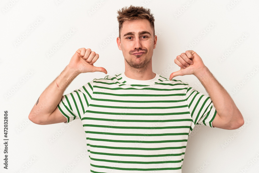Fototapeta premium Young caucasian man isolated on white background feels proud and self confident, example to follow.
