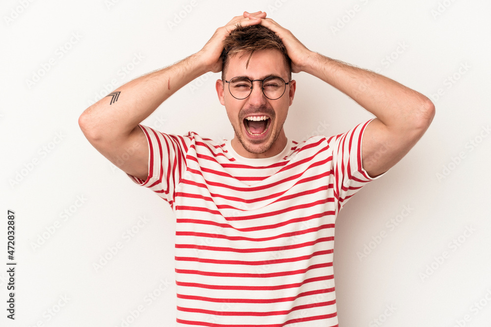 Young caucasian man isolated on white background screaming, very excited, passionate, satisfied with something. Young caucasian man isolated on white background screaming, very excited, passionate, satisfied with something.