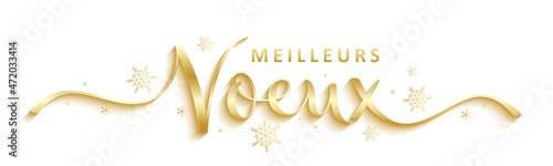 Bannière calligraphique vecteur MEILLEURS VOEUX en or sur fond noir avec flocons de neige