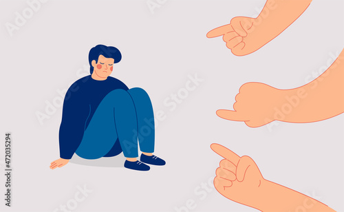 Sad man suffers from psychological abuse. Depressed man surrounded by big aggressive hands pointing at him. Public censure and victim-blaming. Bullying concept.