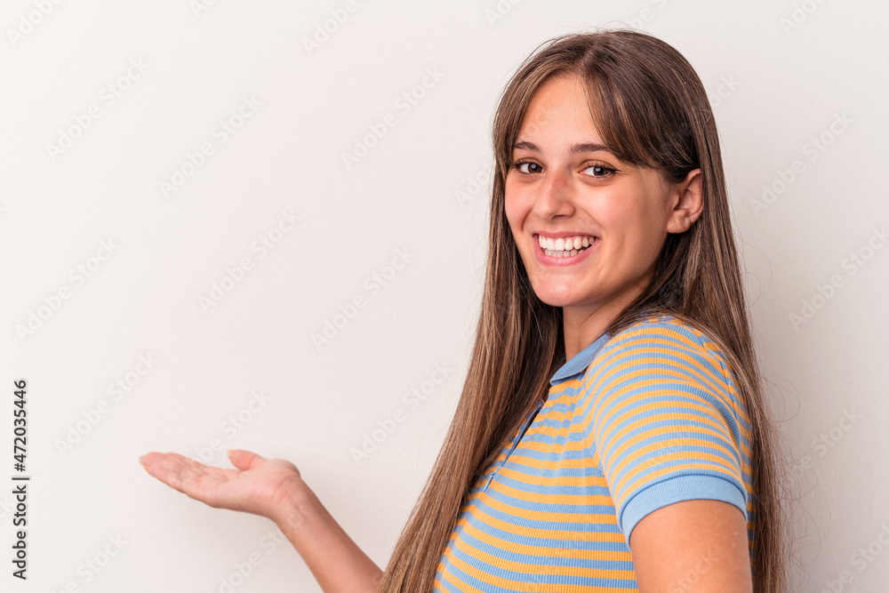 Young caucasian woman isolated on white background showing a welcome expression. Young caucasian woman isolated on white background showing a welcome expression.