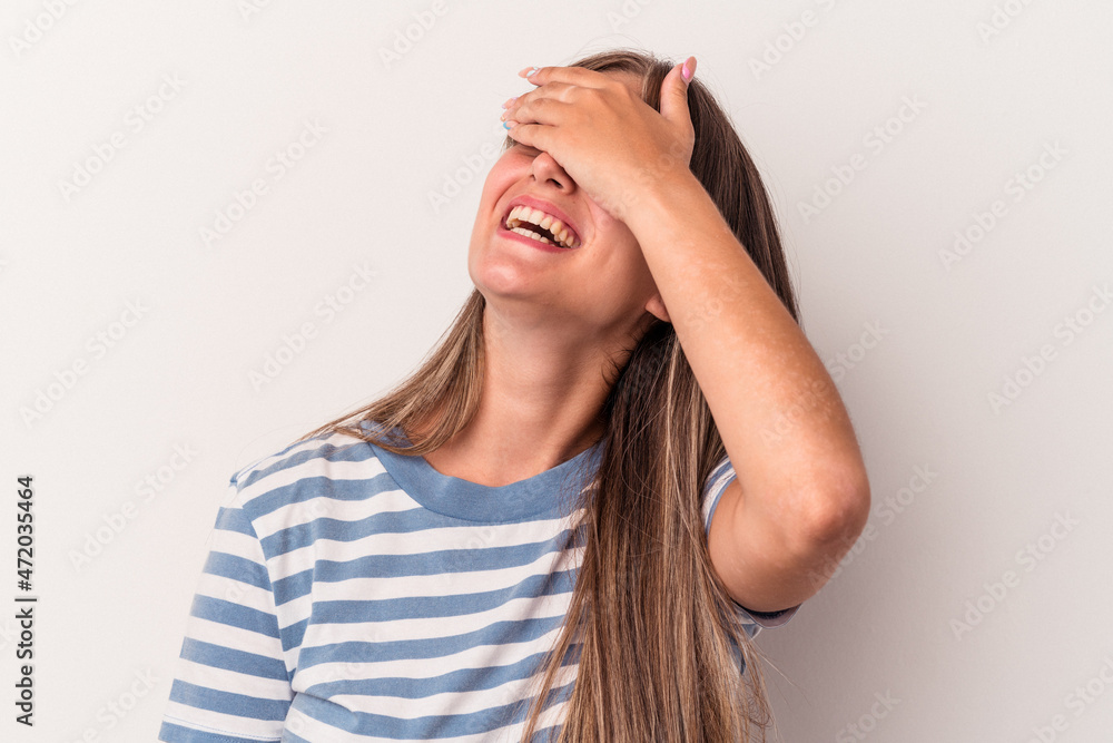 Young caucasian woman isolated on white background laughs joyfully keeping hands on head. Happiness concept. Young caucasian woman isolated on white background laughs joyfully keeping hands on head. Happiness concept.